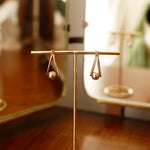 Gold Double Oval Hoop Earrings with White Gold Sphere Accent